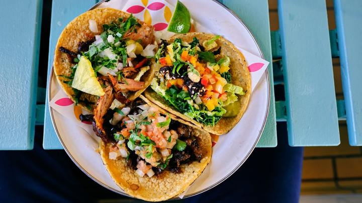 Eat More Tacos Tour logo image