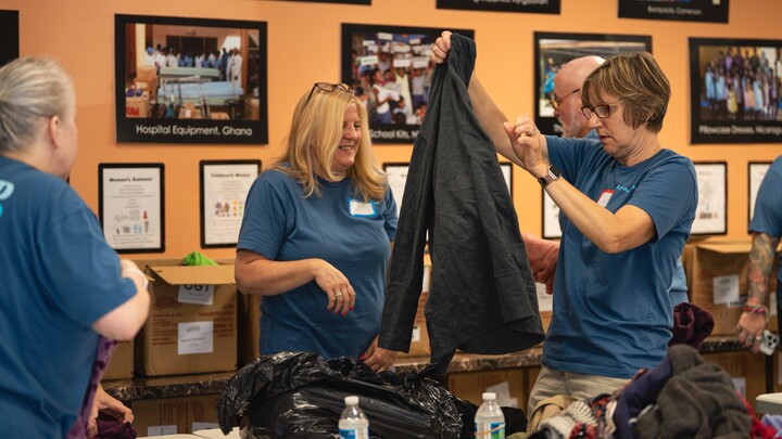 Serve with Orphan Grain Train - Sorting Clothing & Warehouse Work logo