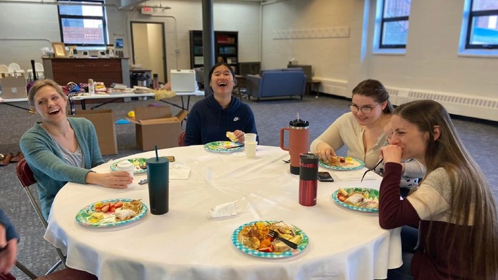 The Mom Collective logo